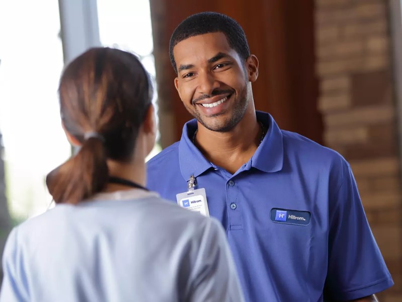 Female and male physicians talking to eahc other