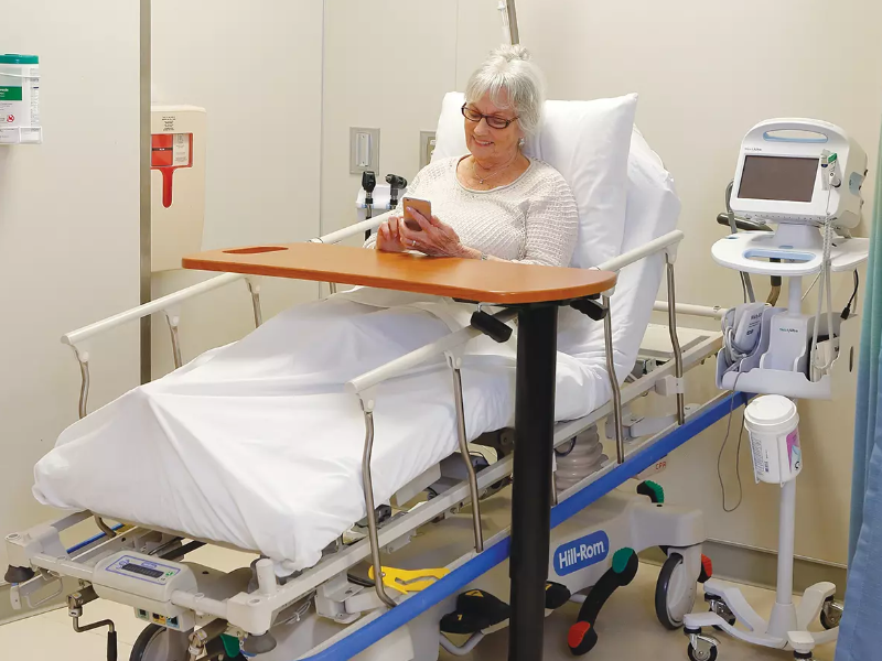 A patient lying in a Procedural Stretcher.