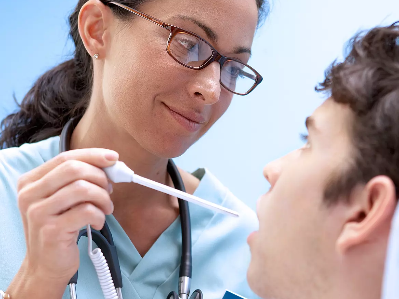 A nurse using the Suretemp plus 692 thermometer.
