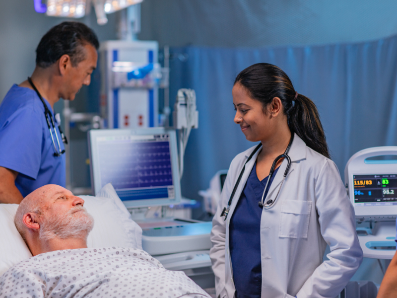 A doctor speaking to an elderly patient.