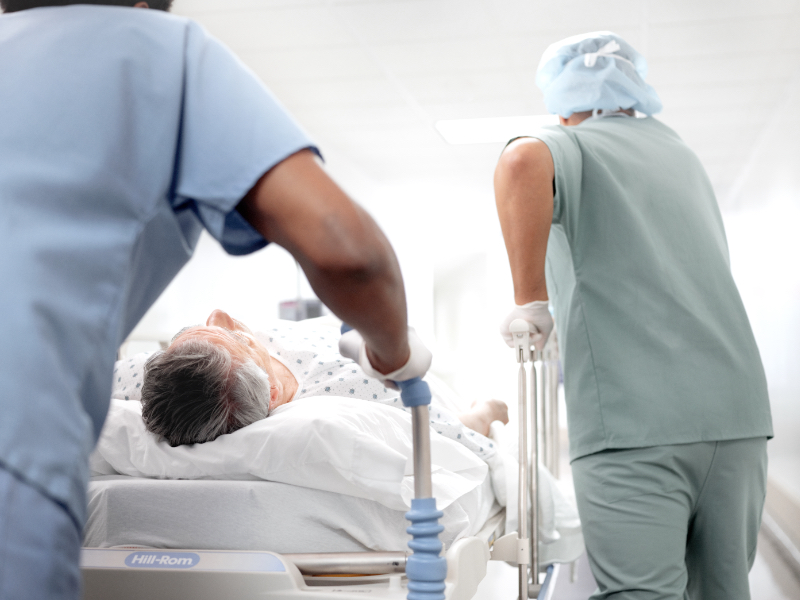A patient on a stretcher going to the ER.