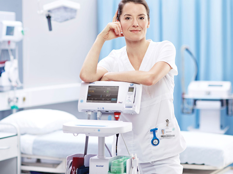 Nurse with CONNEX Spot Monitor and BP Cufss
