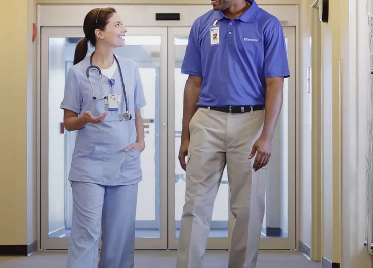 Two members of staff walking next to each other.